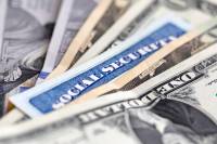 Social Security card money dollar bils iStock uMs7Xy
