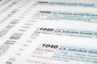 Stack of 1040 tax forms iStock aquqHm