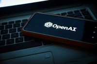 OpenAI logo smartphone Unsplash gXdqPu