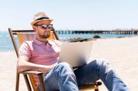 Freepik man working on beach laptop brPmLu